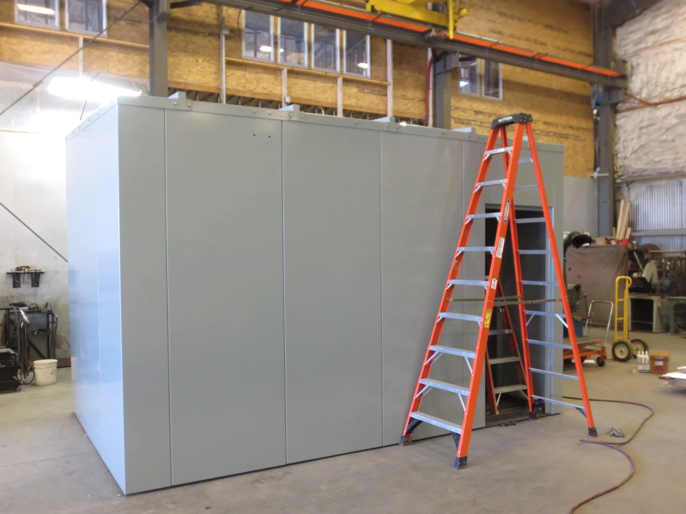 Finished gray custom electrical enclosure inside the Barnes fabrication shop